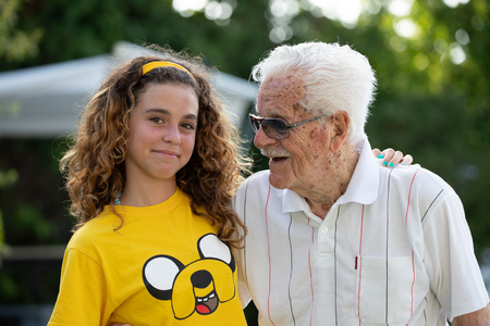 portrait of a great-grandfather of more than 100 years and his great-granddaughter of 10 years oldの写真素材