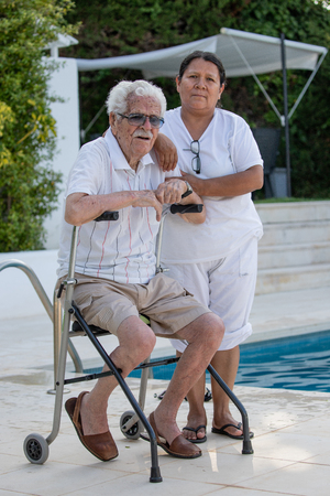Great-grandfather, 100 years old, treated by a nurseの写真素材