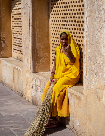 Jaipur, India, 18-20 September 2018, Indian women at work in their usual chores dressed in the typical coloured saris.のeditorial素材