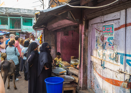 Jaipur, India, 18th to 22nd September 2018 Group of women waiting to be attended in a street establishmentのeditorial素材