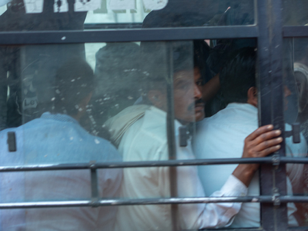 Jaipur, India, 18th to 22nd September 2018 A group of people inside a crowded bus where you can barely breathe.のeditorial素材