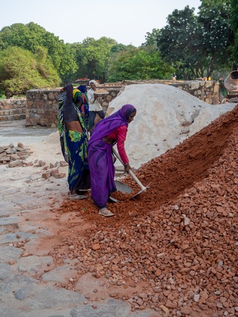 Jaipur, India, 18th to 22nd September 2018 Women working on a construction dressed in multicolored sarisのeditorial素材