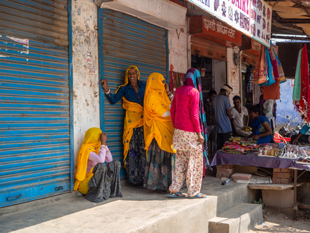 Jaipur, India, 18th to 22nd September 2018 Group of women waiting to be attended in a street establishmentのeditorial素材