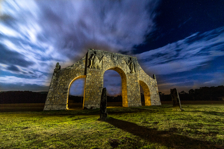 Nocturnal photograph of long nocturnal exposure to a Roman arch and illuminated by lanterns.の写真素材