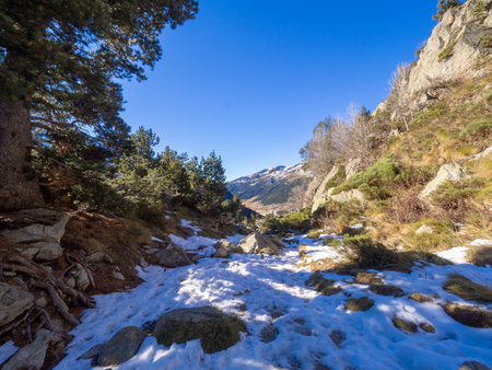 Photograph of a mountainous and snowy landscape on a sunny day in Andorraの写真素材