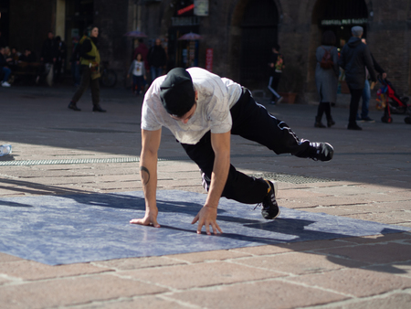 February, 16 2019 Bologna, Italy. Some boys dance break dance in the middle of a street in Bologna, Italy and in front of a church.のeditorial素材