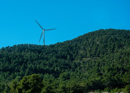 Pictures of wind energy mills from a car on the motorwayの写真素材