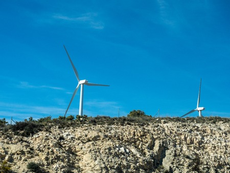 Pictures of wind energy mills from a car on the motorwayの写真素材