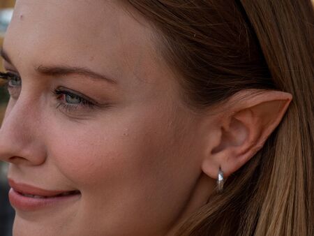 Makeup on the ears to a model to turn her into an elfの写真素材