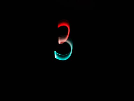 Numbers, from 0 to 9, made with colour lanterns and black