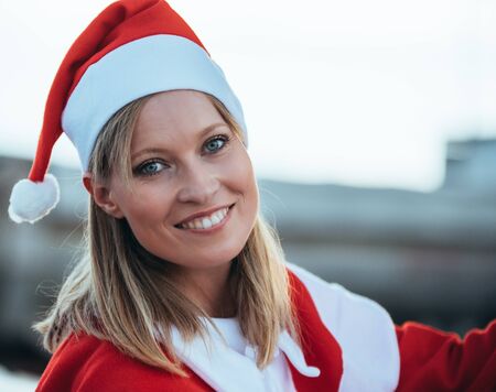 Stock photo of a close-up photo of causal girl and blonde dressed as mama noel. Christmas timeの写真素材