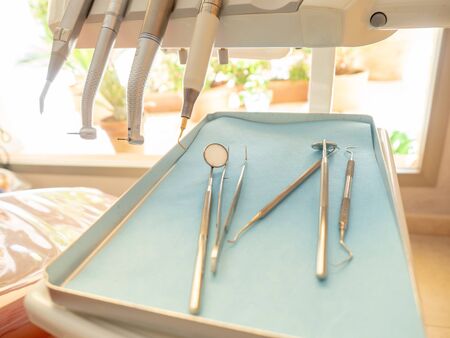 Close-up of a dentist's instrument in the clinic where he attends patients.の写真素材