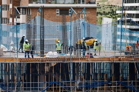 April, April 15 2020, in Madrid, Spain workers work with protective masks to avoid being infected by the covid virus 19のeditorial素材