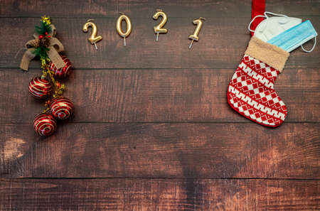christmas gifts and christmas decoration on a wooden background