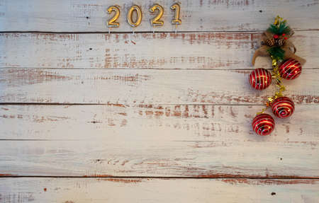 Light wood background with veins and horizontal, with Christmas decoration 2021