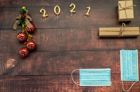 christmas gifts and christmas decoration on a wooden backgroundの写真素材