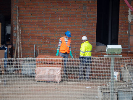 November, 16 2020, in Madrid, Spain, some workers working in construction during the pandemicのeditorial素材