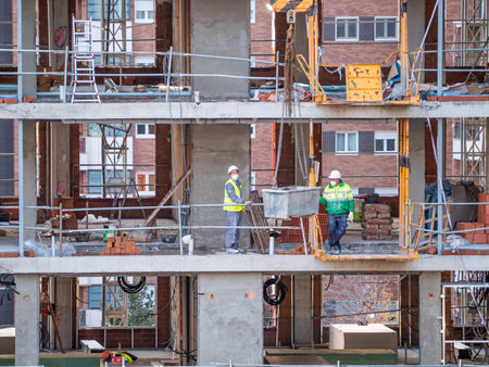 November, 10 2020, in Madrid, Spain some workers working in construction during the pandemicのeditorial素材