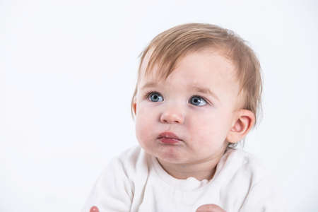 Stock studio photo with the white background of a baby's faceの写真素材