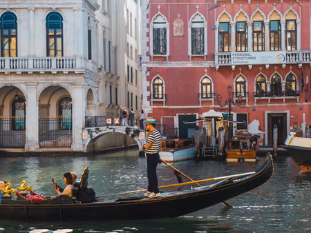 October 30, 2022 - Venice, Italy: Gondola on the water canals of Venice. Tourism concept.の写真素材