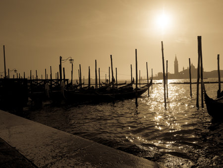 Gondolas moored in the grand canal in Venice. Tourism concept.の写真素材