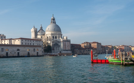 View of the basilica Santa Maria della Salute in the grand canal in Venice. Tourism concept.の写真素材
