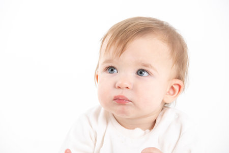 Stock studio photo with the white background of a baby's faceの写真素材