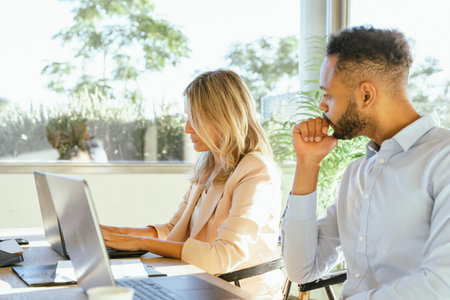Two work colleagues working in the office. Business concept.