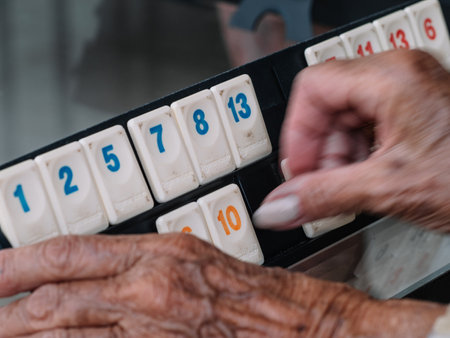 Board game for seniors consisting of making combinations of numbers, winning the first to place all their chipsの写真素材