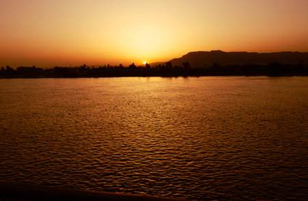 View of the sunset on the Coastline of the Nile river in Egypt. Tourism concept.