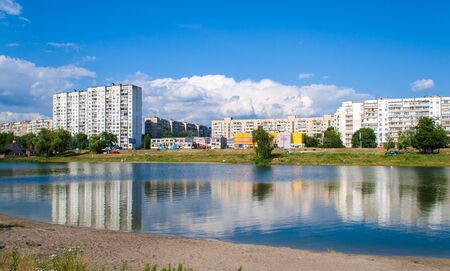 Residential buildings over a lake  Kyiv, Ukraineの写真素材
