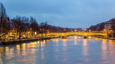 View of the bridge Louis-Philippe over the Seine in Parisの写真素材