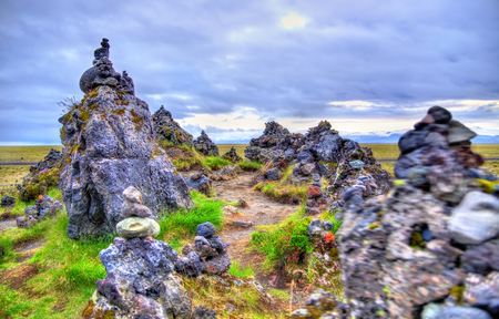 Laufscalavarda, a lava ridge, surrounded by stone cairns - South Icelandの写真素材