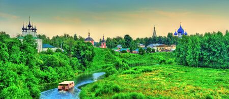Suzdal town over the Kamenka river in Russiaの写真素材