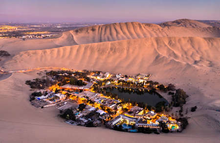 Aerial sunset view of the Huacachina Oasis in Peruの写真素材