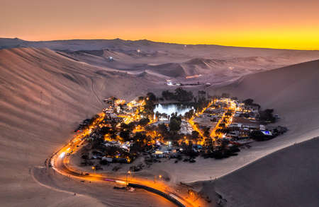 Aerial sunset view of the Huacachina Oasis in Peruの写真素材