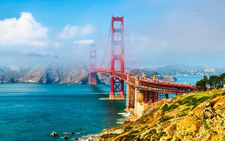 Golden Gate Bridge Shrouded in Mystical Fog Overlooking the Bay in San Francisco - California, United Statesの写真素材