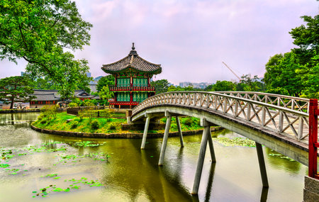 Hyangwonjeong Pavilion with Chwihyanggyo Bridge at Gyeongbokgung Palace in Seoul, South Koreaの写真素材
