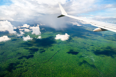 Airplane flying above the Amazon Rainforest of Guyana in South America