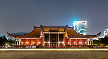 The Sun Yat-sen Memorial Hall in Taipei, Taiwan, features traditional Chinese architectural design and stands brightly lit at night, honoring the founder of the Republic of China.の写真素材