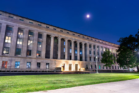 The Forum Building, home to the State Library of Pennsylvania, in Harrisburg, USA. This historic Capitol Complex landmark is illuminated under the moon at nightの写真素材