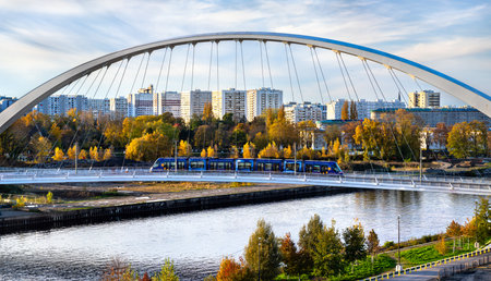 Strasbourg, France - October 30, 2025: Modern city tram connecting France and Germany on the Citadelle Bridge across Bassin Vaubanのeditorial素材