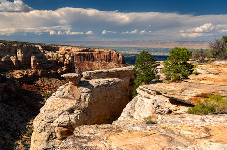 View from Cold Shivers Point Overlook in Colorado National Monument. White sandstone is in the foreground, with Columbus Canyon and the Grand Valley belowの写真素材