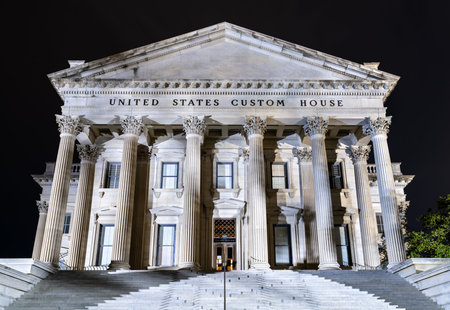 United States Custom House in Charleston, South Carolina. Historic Neoclassical building features massive Corinthian columns and steps illuminated at nightの写真素材