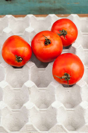 fresh ripe red tomatoes in the box.の写真素材
