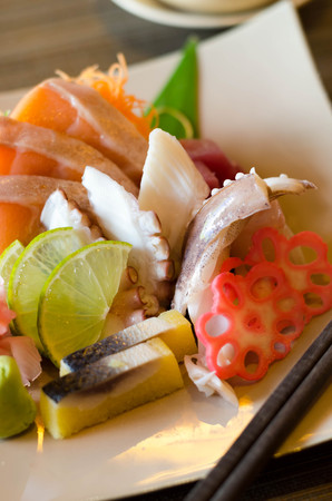 A colorful platter of sashimi sushi with octopusの写真素材