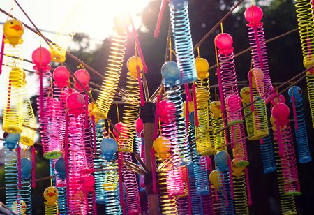 colorful plastic toys on asian street market.の写真素材