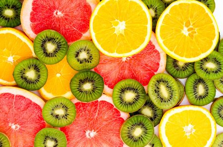 Bright background with kiwi fruit, grapefruit and oranges.の写真素材