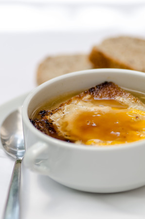 Hot soup with onion and cheese.の写真素材