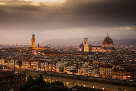 View of Florence during sunset showing the River Arno, the Palazzo Vecchio and the Duomo - Florence, Tuscany, Italy - 24th May 2016のeditorial素材